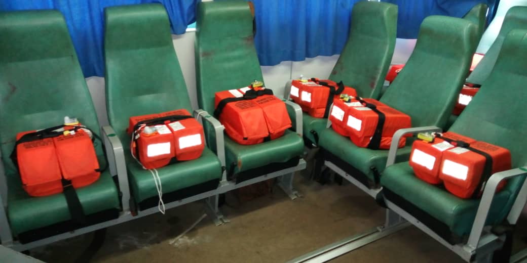 Orange life jackets placed on each passenger seat