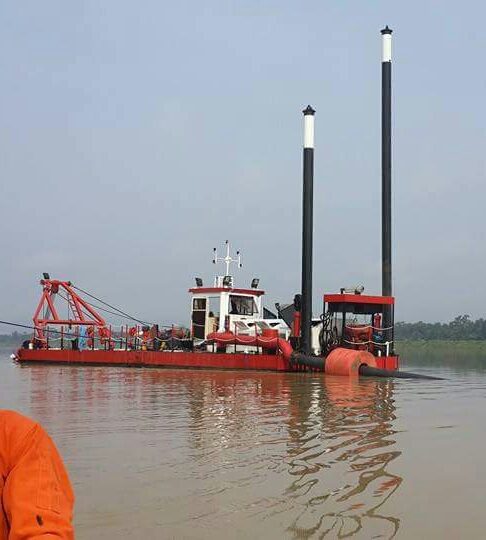 Dredging vessel with spuds deployed