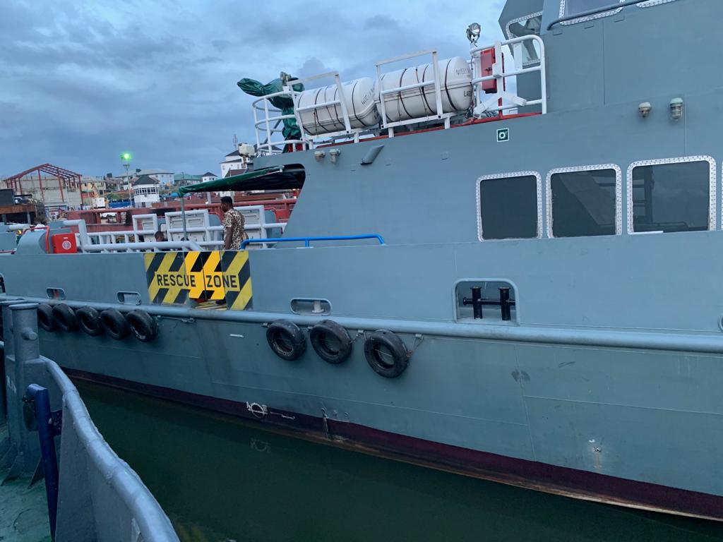 Vessel side with marked rescue zone and life-raft canisters